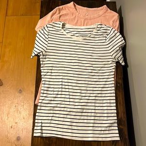 Two womens tops size medium, form fitting, one pink and ribbed, one b&w stripes